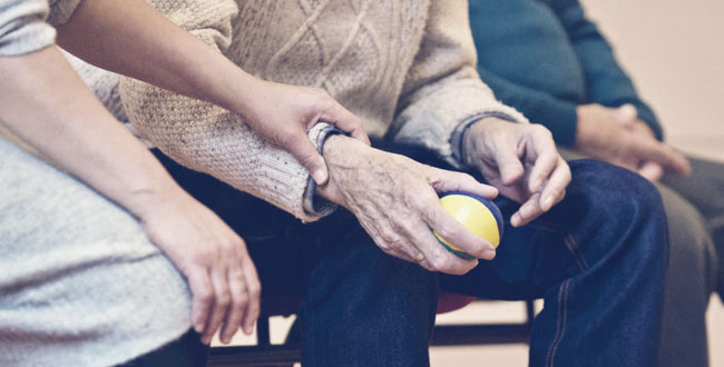 Elderly person with a therapy nurse